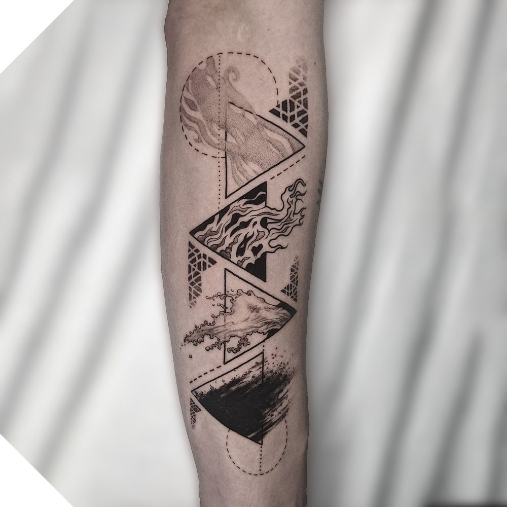 Four Elements Tattoo Design: 7 Styles That Hold Their Own 1 Black ink tattoo on an arm featuring four stacked triangles with elemental patterns.