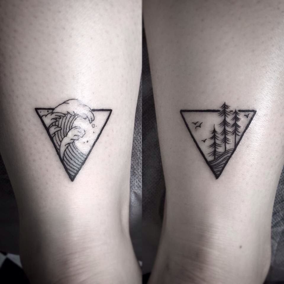 Four Elements Tattoo Design: 7 Styles That Hold Their Own 5 Two black ink tattoos on skin featuring landscape scenes inside inverted triangles.