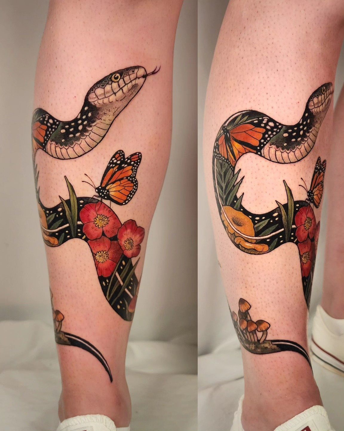 A large tattoo of a winding snake with butterflies and red flowers on a person's leg.
