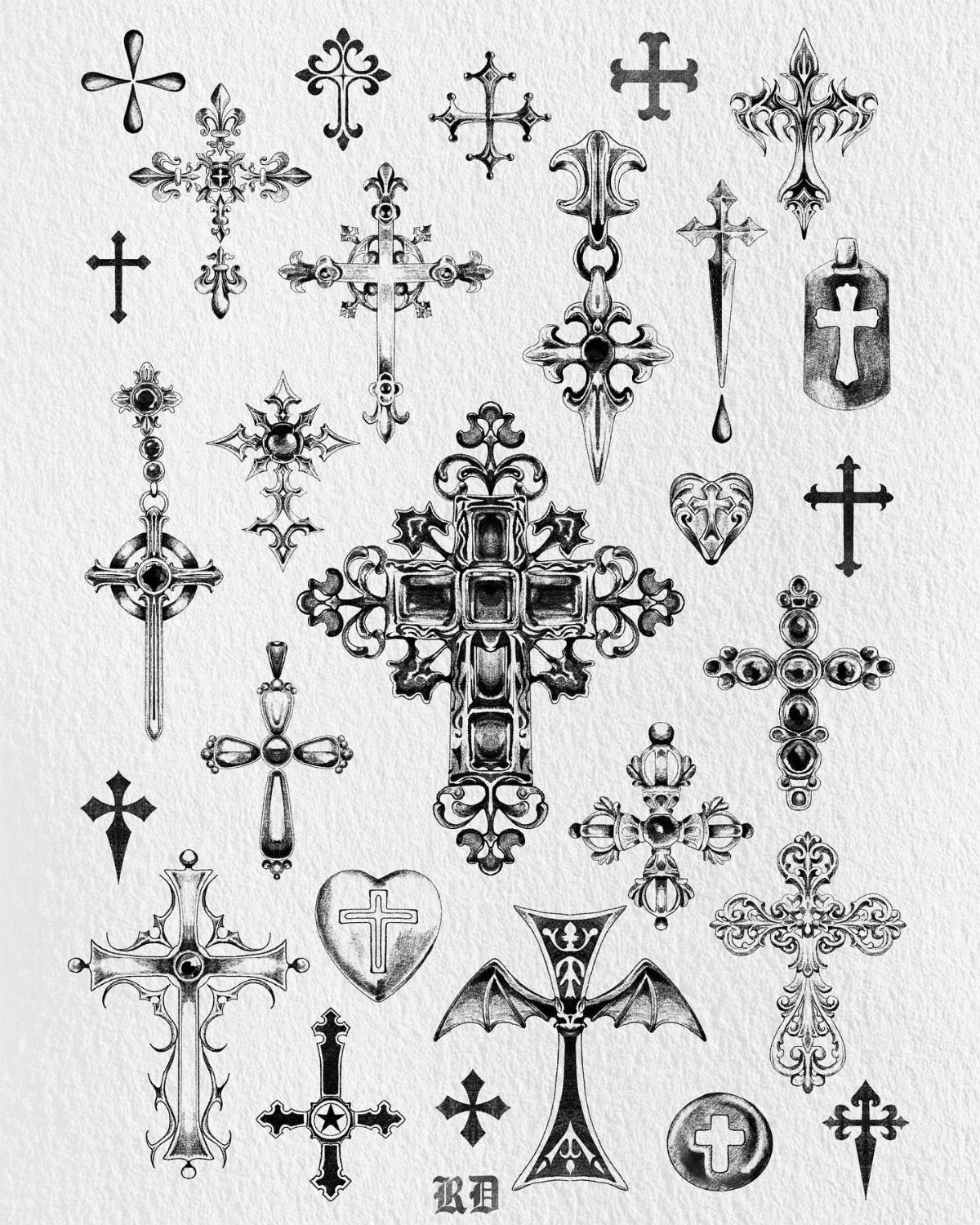 Various black and white gothic cross sketches and ornate religious designs on white paper.
