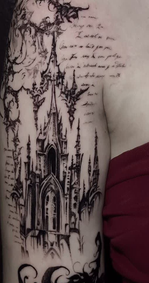 8 Tattoo Pattern Gothic Ideas: From Crows to Cathedral Arches 7 A detailed black ink tattoo of Gothic architecture with spires and ornate patterns on a person's arm.