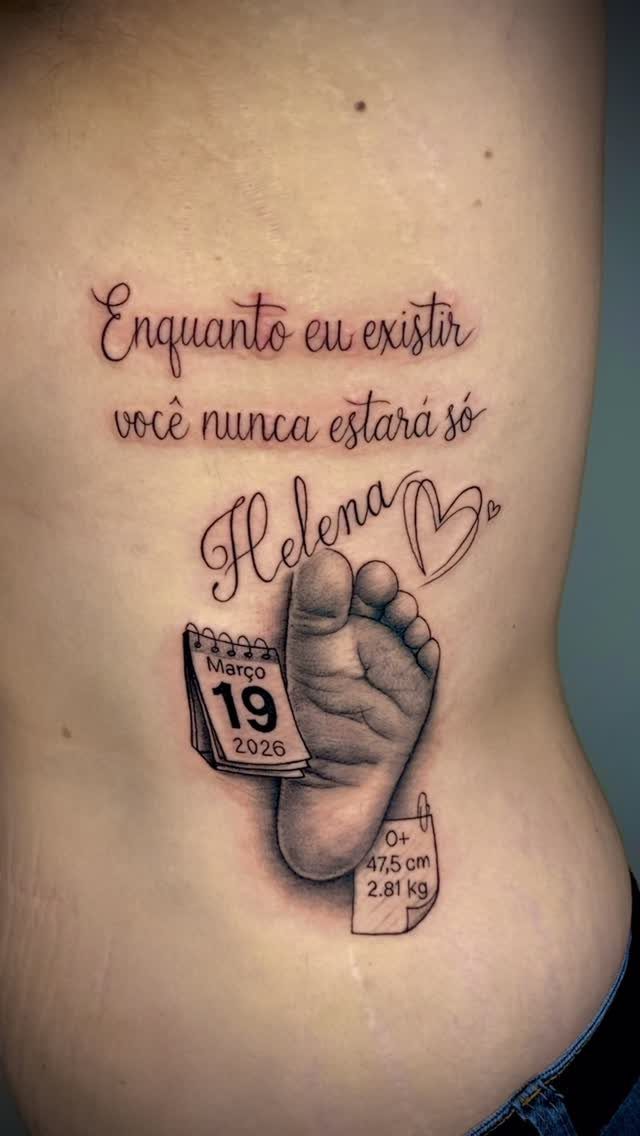 16 Word Tattoo Placement Ideas: From Spine to Finger 5 A realistic black and grey tattoo on a person's ribcage featuring text and a baby footprint.